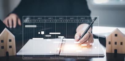 hombre utilizando bolígrafo Nota libro con planificación análisis y proyecto administración en línea. valores mercado inversiones y digital activos, analizando forex comercio grafico financiero datos. negocio Finanzas antecedentes. foto