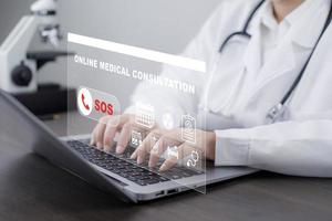 Laptop with SOS online medical consultation concept, Doctors specialize in telephone assistance for consulting contact, medical secret, emergency online medical, appointment by email or phone photo