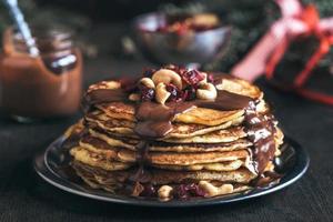 Sweet chocolate on pancakes photo