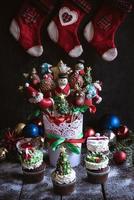 Christmas table with cup cakes and cake pops photo