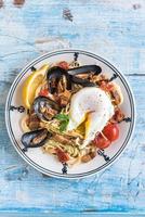 Mussel with spaghetti and egg photo