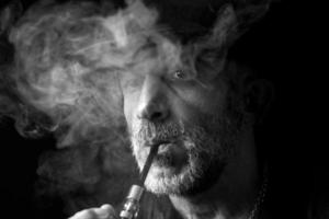 Man in the smoke portrait photo