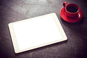 Tablet and coffee photo