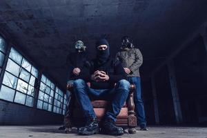The terrorists with gas mask and guns photo