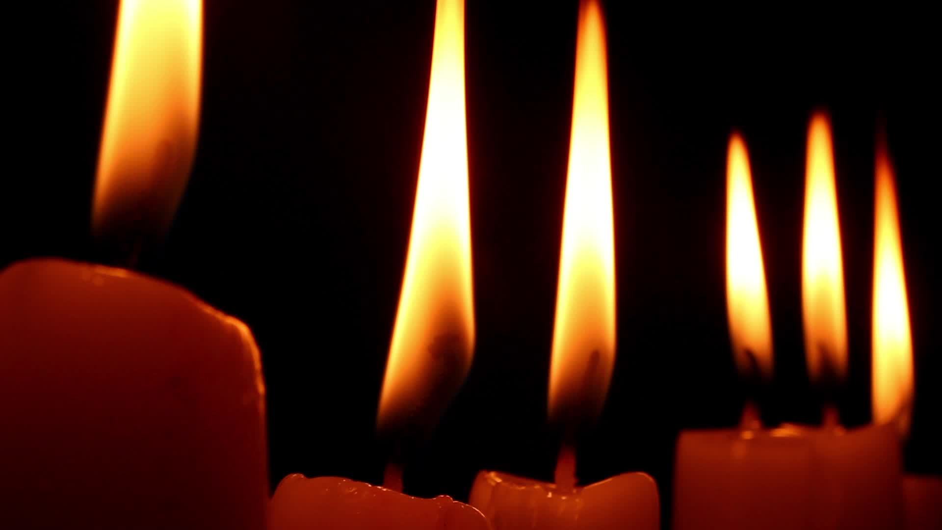 Burning Candles Black Background 23031153 Stock Video at Vecteezy