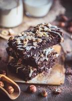 Chocolate brownies with almonds photo