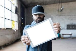 Man holding tablet pc photo