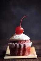 Chocolate cupcake with cherry photo