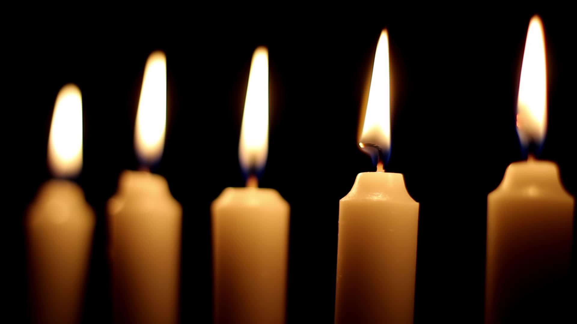 Burning Candles Black Background 23031861 Stock Video at Vecteezy