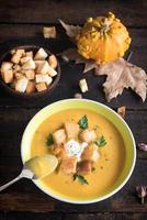 Pumpkin soup in the plate photo