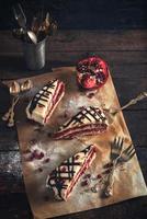 Slices of chocolate and pomegranate cake photo
