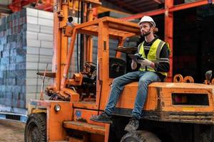 Architect, foreman working at construction or architecture site photo