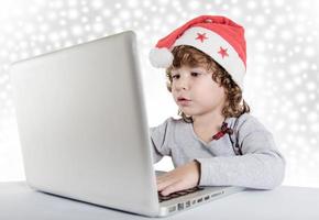 Little child with Santa hat photo