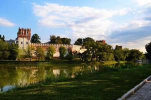 The wall of old monastery near the river. photo