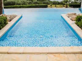 Home swimming pool in garden and villa terrace - summer holidays and luxury lifestyle concept photo