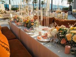 Luxury elegant wedding reception table arrangement and floral centerpiece - wedding banquet and event outdoor photo