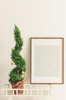 Indoor cypress or thuja in pot is decorating balls baubles like Christmas tree. Alternative Xmas trees and mockup with empty blank for advertising. Copy space and space for text photo