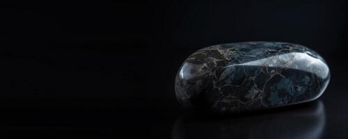 Musgravite is a rare precious natural stone on a black background. . Header banner mockup with space. photo