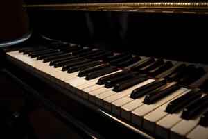 Black and white piano keys on a black background. . photo