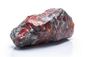 Painite is a rare precious natural geological stone on a white background in low key. . photo