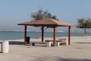 a beautiful view of sea through hut, outdoor photo