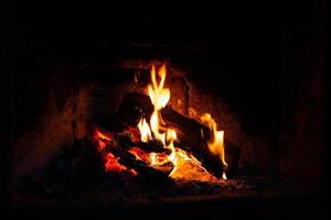 burning logs in the fireplace photo