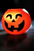 Halloween pumpkin head with golden light in dark night bakckground. Halloween holiday concept. photo