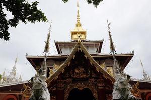 Heritage Golden sanctuary and chapel in the temple of lanna style name is  Wat Pa Dara Phirom Phra Chulamani Si Borommathat at Chiangmai province Thailand. photo
