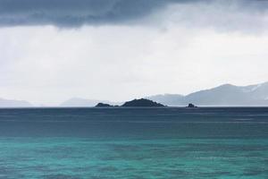 Beautiful seascape of tropical island with blue sea and mountain beach in cloud storm at Koh Lipe in Satul Province, Thailand photo