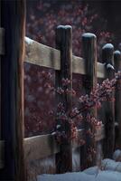 wooden fence covered in snow next to a tree. . photo