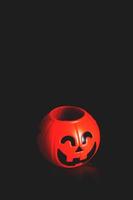 Halloween pumpkin head with golden light in dark night bakckground. Halloween holiday concept. photo