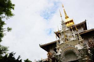 Heritage Golden sanctuary and chapel in the temple of lanna style name is  Wat Pa Dara Phirom Phra Chulamani Si Borommathat at Chiangmai province Thailand. photo