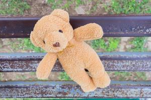 bear toy on iron bench ,top view photo
