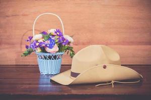 Anzac army slouch hat with Australian Flag on vintage wood background photo