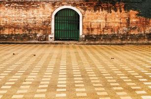 Old entrance door of an old abandoned building. photo