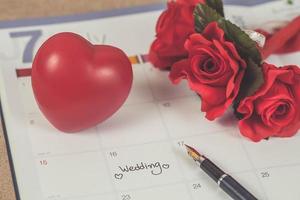 Reminder Wedding day in calendar planning and fountain pen with color tone. photo