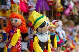 Puppets for sale on a market stall photo