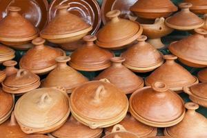 Stack of tajines for sale at a Moroccan souk photo