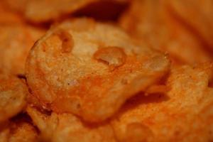 Top view of potato chips with paprika spice fast food concept eating junk food background high quality big size instant prints stock photography photo