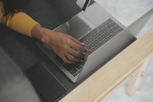 Close up of woman hand using credit card and laptop for payment and online shopping, Online shopping, payments digital banking, E-commerce concept. photo