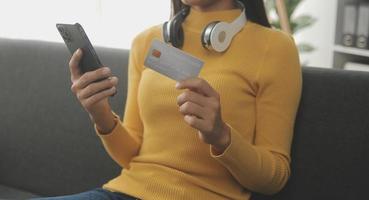 Close up of woman hand using credit card and laptop for payment and online shopping, Online shopping, payments digital banking, E-commerce concept. photo