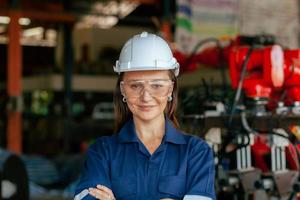 An expert engineer controls automation in a smart factory. Robot welding in a factory. photo