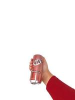 Bekasi, Indonesia in March 2023. Isolated white photo of a hand holding a Rootbeer AW softdrink.