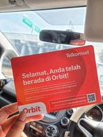 Jakarta, Indonesia in March 2023. A hand is holding a box and a card from a modem with the product Orbit Star Z1 photo