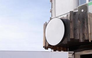 white round logo on building wall , exterior for mockup design photo