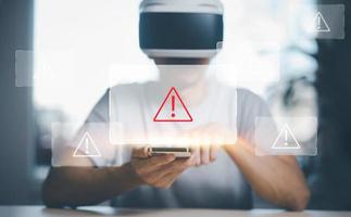 Man wearing VR glasses virtual touch Hacker touch laptop or smartphone and Touching in graph Screen code of a media screen on the White background, Technology Process System Business and hacks online. photo