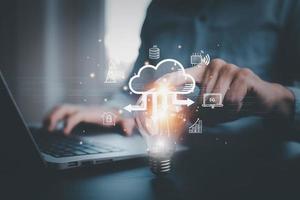 Businessman holding Light bulb Global Internet connection with Cloud technology, Data storage Networking and internet service, global internet connection application technology , Financial and banking photo