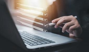 checklist and clipboard task documentation management, business people working laptop checklist questionnaire assessment form, online survey online exam Choosing the right answer in the exam photo