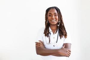 Raised hand of young African woman clenched into fists on light background. Stop racism concept photo