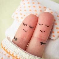 Finger art of a Happy couple. Couple asleep in bed. photo